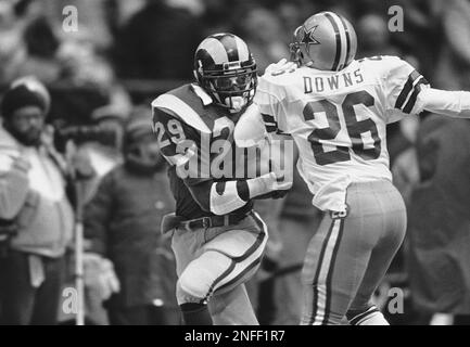 Los Angeles Rams halfback Eric Dickerson confronts New England