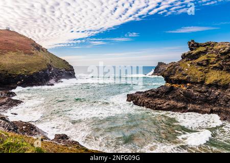 Boscastle Harbour and the Devil's Bellows blowhole at low tide, Boscastle, Cornwall, UK Stock Photo