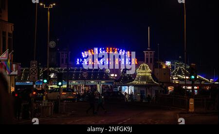 Traffic approaches the Brighton Palace Pier at night , Sussex , England UK Stock Photo