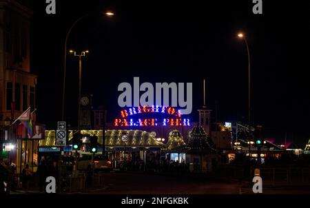 Traffic approaches the Brighton Palace Pier at night , Sussex , England UK Stock Photo