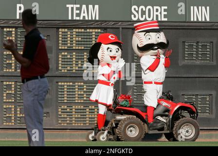 Cincinnati Reds mascot Mr. Redlegs with the Ohio Cup prior to a