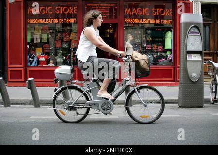 Associated Press journalist Emma Vandore rides her electric bike