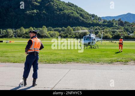 Switzerland, Agno-Lugano Airport, Helicopter on take off Stock Photo