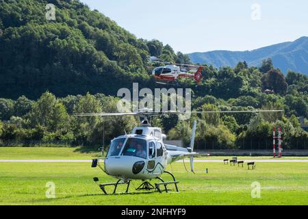 Switzerland, Agno-Lugano Airport, Helicopter on take off Stock Photo