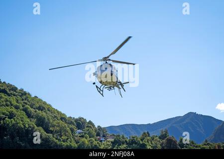 Switzerland, Agno-Lugano Airport, Helicopter on take off Stock Photo