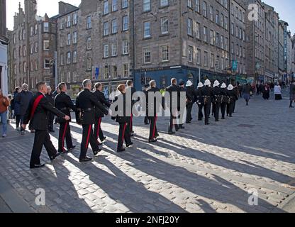 Firefighter Barry Martin's cortege makes it way through Royal Mile to St Giles Cathedral, Edinburgh, Scotland, UK. 17th February 2023. Pictured:  Hundreds of residents together with hundreds of Firefighters and other emergency service workers lined the High Street  to honour the Fife Firefighter who lost his life while tackling the Jenners fire on Princes Street. Credit:Archwhite/alamy live news. Stock Photo