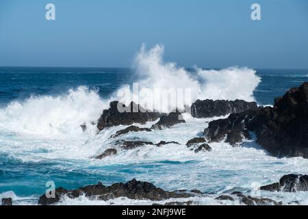 ocean waves crashing on rocks ,windy weather Stock Photo