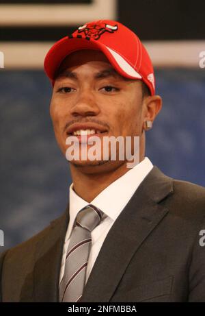 Bulls draft pick Derrick Rose dons a White Sox hat as he stands beside  Chicago White Sox manager Ozzie Guillen during pre-game activities at U.S.  Cellular Field in Chicago, Illinois, Friday, June