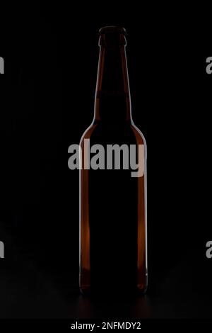 A bottle of beer on a black background. Stock Photo