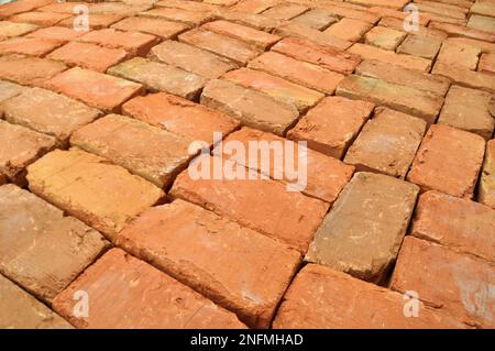 In the pile is a ready-made fired brick made of clay Stock Photo