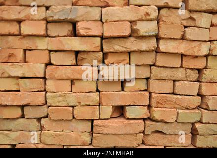 In the pile is a ready-made fired brick made of clay Stock Photo