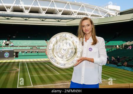Elena Rybakina poses with her Champions trophy, the Venus Rosewater Dish, after winning the Ladies' Singles tennis final at The Championships 2022. Stock Photo