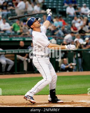 Texas Rangers' Michael Young, looks on after getting his 211th hit