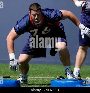 Denver Broncos tackle Tyler Polumbus takes part in drills during