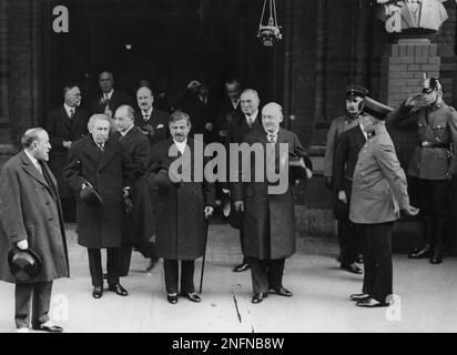 The French delegation with Aristide Briand and Pierre Laval, front row second and third from left, were greeted by German chancellor Heinrich Bruening, fourth from left, at their arrival and are seen as they leave the train station at Friedrichstrasse in Berlin, Germany. September 27, 1931. Walking behind Briand and Laval is Dr. Julius Curtius and further behind the two is French ambassador Francois Ponchet. (AP Photo)