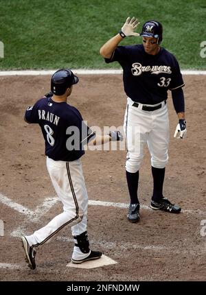 Milwaukee Brewers' Ryan Braun (8), Gabe Kapler (33) and Mike Cameron,  center, celebrate after the ninth inning of a baseball game against the  Pittsburgh Pirates on Sunday, July 6, 2008, in Milwaukee.