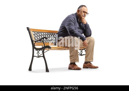 Pensive mature man sitting on a bench and thinking isolated on white background Stock Photo