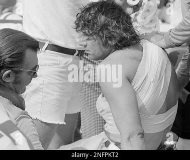 New York Jet quarterback Joe Namath stands with bowed head after being  injured in the first quarter of the Jets-Colt game at Memorial Stadium on  Sept. 23, 1973, in Baltimore, Maryland. Namath