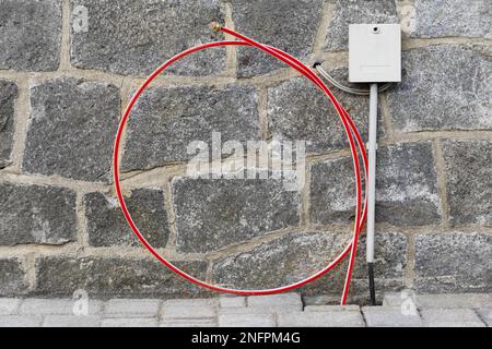 Telekom house connection with fibre optic cable Stock Photo