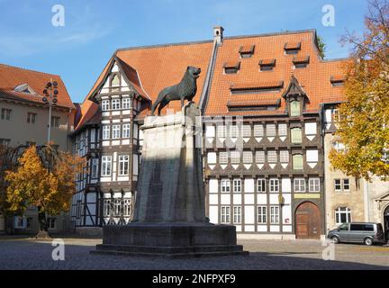 Braunschweig, Germany - October 15, 2019: Brunswick Lion monument located on historic Burgplatz castle square with timber-framed houses in the Stock Photo