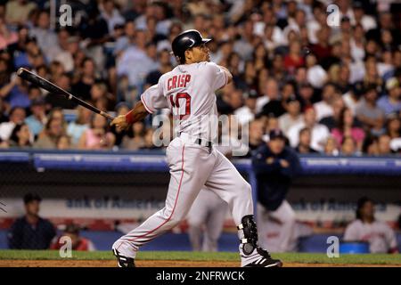 Boston Red Sox centerfielder Coco Crisp, left, is congratulated by