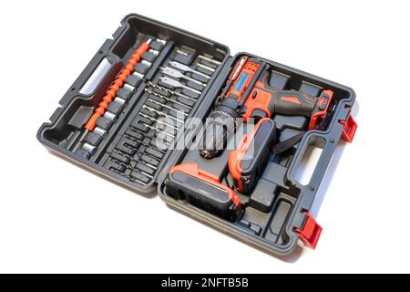 Tool case with electric drill of batteries without cables and different bits and screwdrivers. Stock Photo