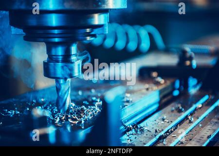 CNC Milling Machine During Operation. Nozzle Part Closeup. Production Technology and Manufacturing Equipment Theme. Stock Photo