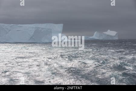 Icebergs in heavy sea near the Antarctic Sound Stock Photo