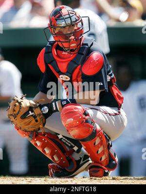 Atlanta Braves catcher Javy Lopez puts on his gear during a Major