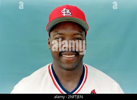 St. Louis Cardinals Vince Coleman, center, lies on the field of