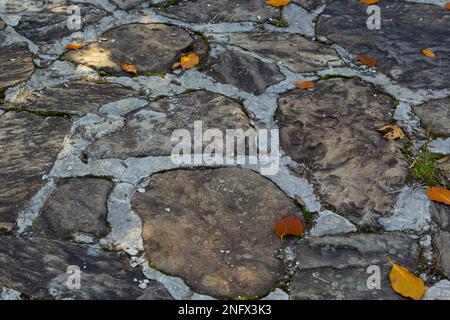 top view of concrete floor with colorful granite stone, cement floor of garden path way or patio decorated with various color and shape stone slabs, a Stock Photo