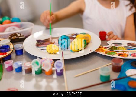 colouring eggs for eastertime at home Stock Photo