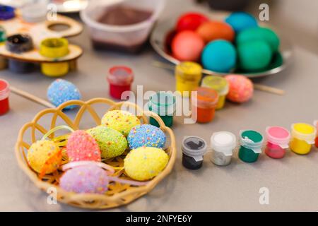 colouring eggs for eastertime at home Stock Photo