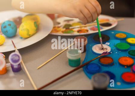 colouring eggs for eastertime at home Stock Photo