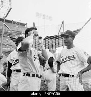 Chicago White Sox shortstop Luis Aparicio is still in air after firing ball  to first base