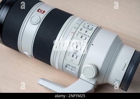 G-Master Sony FE 70-200mm f2.8 GM OSS II new lens for mirrorless camera. Selective focus, isolated on white backgr Stock Photo