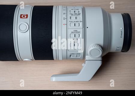 G-Master Sony FE 70-200mm f2.8 GM OSS II new lens for mirrorless camera. Selective focus, isolated on white backgr Stock Photo