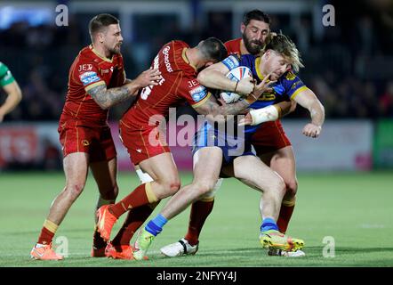Wakefield Trinity’s Tom Lineham is tackled by Catalans Dragons’ Romain Navarrete during the Gallagher Premiership match at Be Well Support Stadium, Wakefield. Picture date: Friday February 17, 2023. Stock Photo