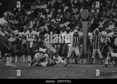 Rams' running back John Cappelletti, the former Heisman winner, is dragged  down by a shirt tackle as he tried to circle the New York Giants' left side  in Los Angeles Sunday, Sept.