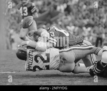 Rams' running back John Cappelletti, the former Heisman winner, is dragged  down by a shirt tackle as he tried to circle the New York Giants' left side  in Los Angeles Sunday, Sept.