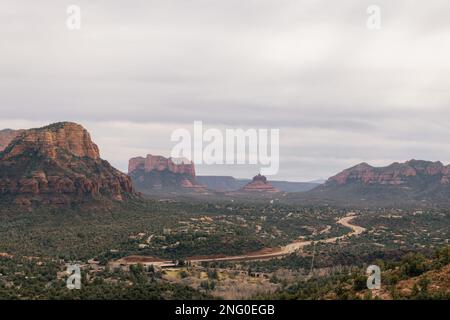 Sunset viewpoint in Sedona Arizona as seen from Airport Mesa Vortex looking towards both sides of town with lovely clouds and red rock mountain cliffs Stock Photo
