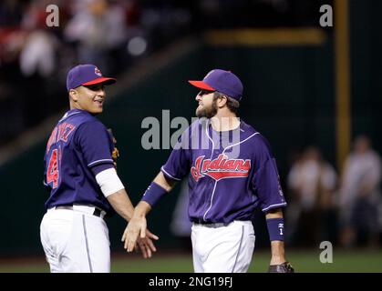 The Cleveland Indians Ben Broussard (C) hit a three run home run to deep  left center in the third inning scoring Victor Martinez (R) and Ronnie  Belliard (L) off of the Baltimore