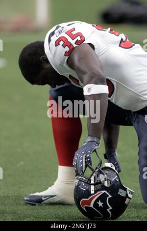 Houston Texans running back Samkon Gado kneels during an NFL