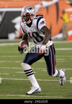 Washington Redskins wide receiver Donte' Stallworth (19) is tackled by New  England Patriots cornerback Devin McCourty (32), rear, Julian Edelman (11)  during the first half at FedEx Field in Landover, MD, Sunday