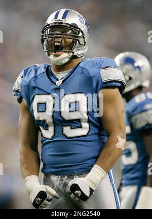 Detroit Lions' Dewayne White (99) goes up against Washington