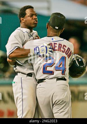 New York Mets Ricky Henderson (24) high-fives with Edgardo Alfonzo