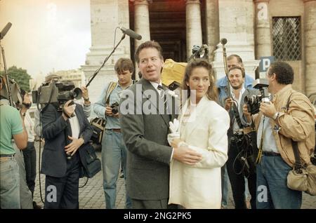 Fashion designer Calvin Klein is seen with his new wife Kelly Rector after their wedding in Rome s City Hall Sept. 26 1986. AP Photo Massimo Sambucetti Stock Photo Alamy