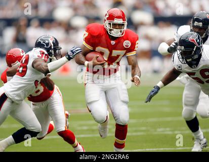 Tampa Bay Buccaneers' wide reciever Thomas Jones (22) tries in vain to  escape a tackle from Houston Texans' centerback Demarcus Faggins (38)  during the Bucs' 16-3 win against the Texans at Raymond