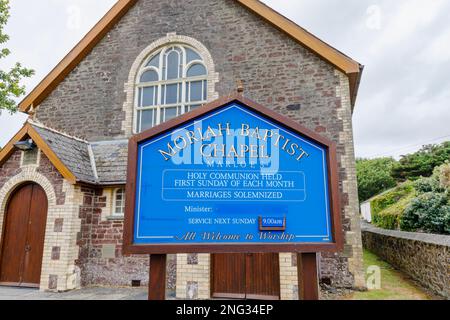 Blue name sign at Moriah Baptist Chapel in Marloes, a small village on the Marloes Peninsula in the Pembrokeshire Coast National Park, west Wales Stock Photo