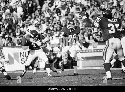 Oakland Raiders defensive end Otis Sistrunk sacks Fran Tarkenton